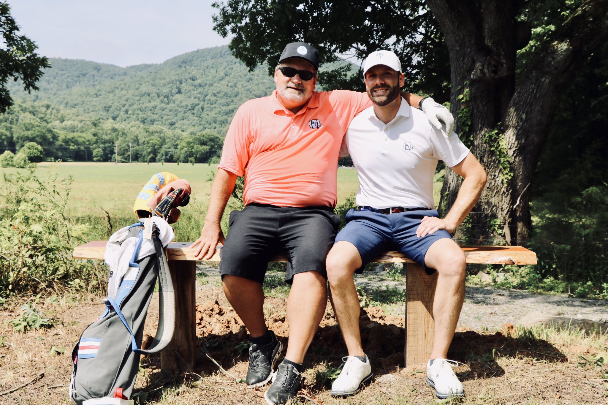 Jim and Trey on the Jim Hartsell Bench, located behind the third tee box at Sweetens Cove